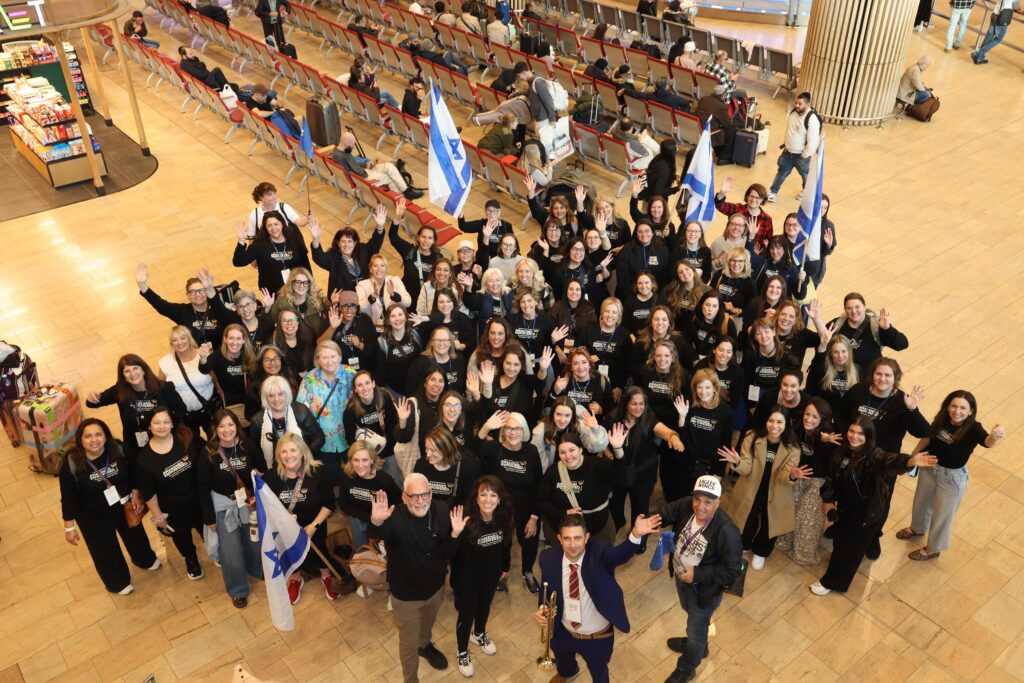Group of 120 Christian women leaders standing together in Jerusalem during solidarity mission to Israel.